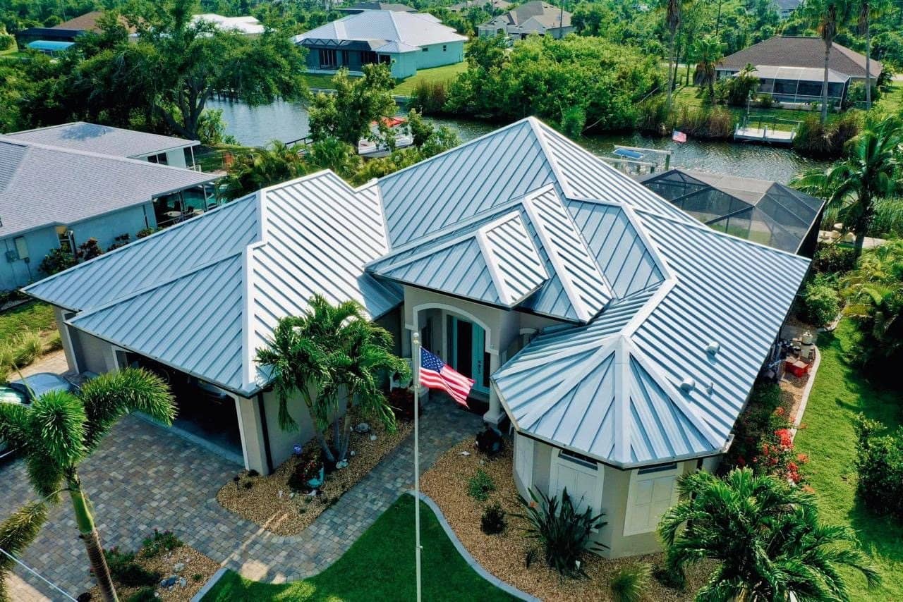 A new standing-seam metal roof installed by Novara Roofing on a South Florida home, seen from above