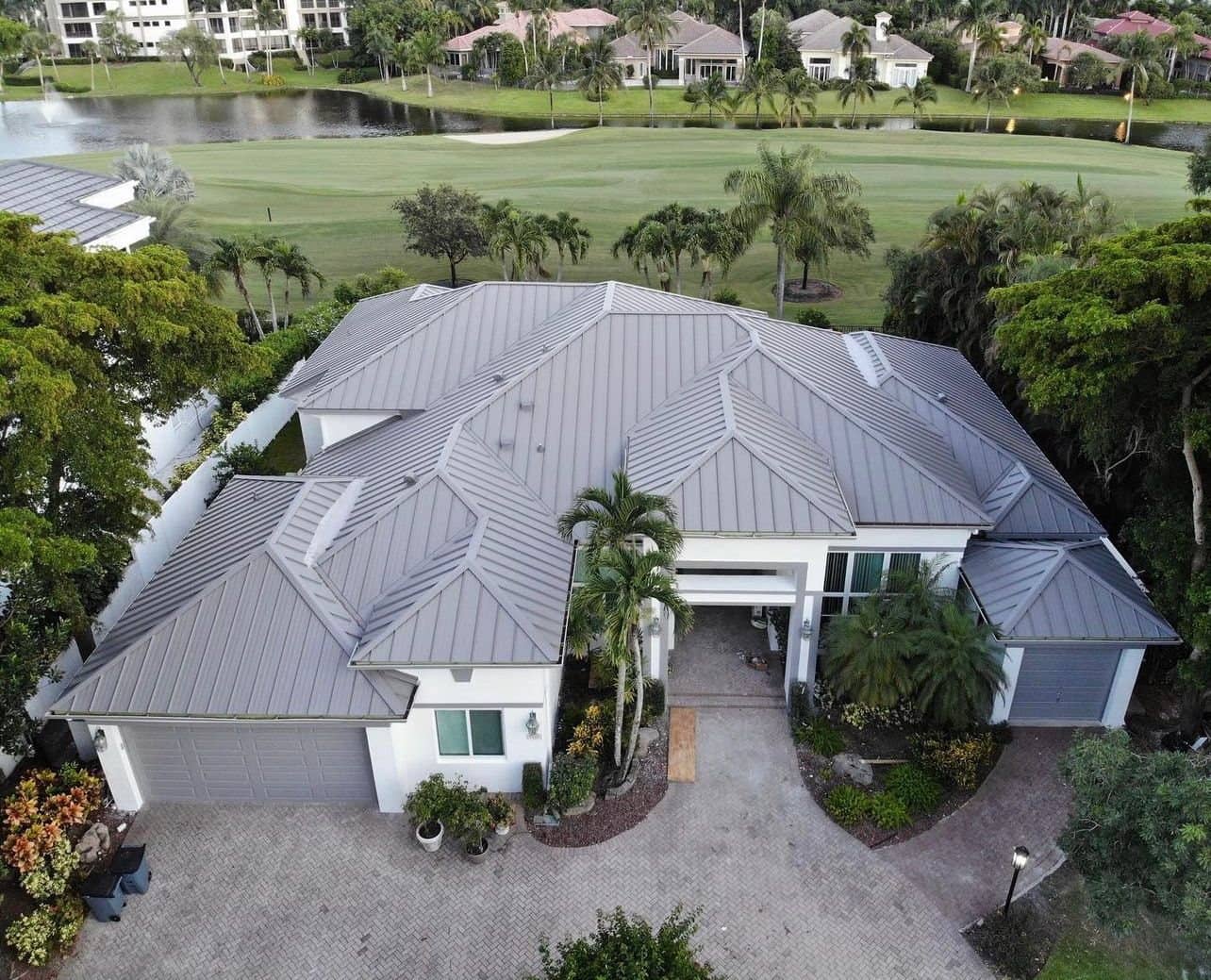Aerial view of a residential metal roof replacement in Palm Beach