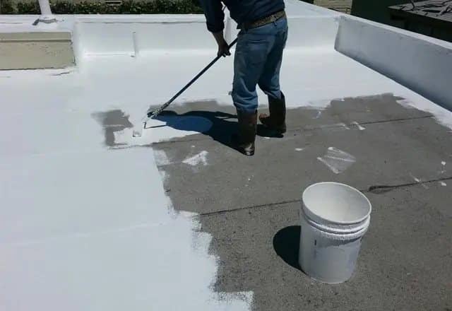 Applying silicone roof coating with a roller