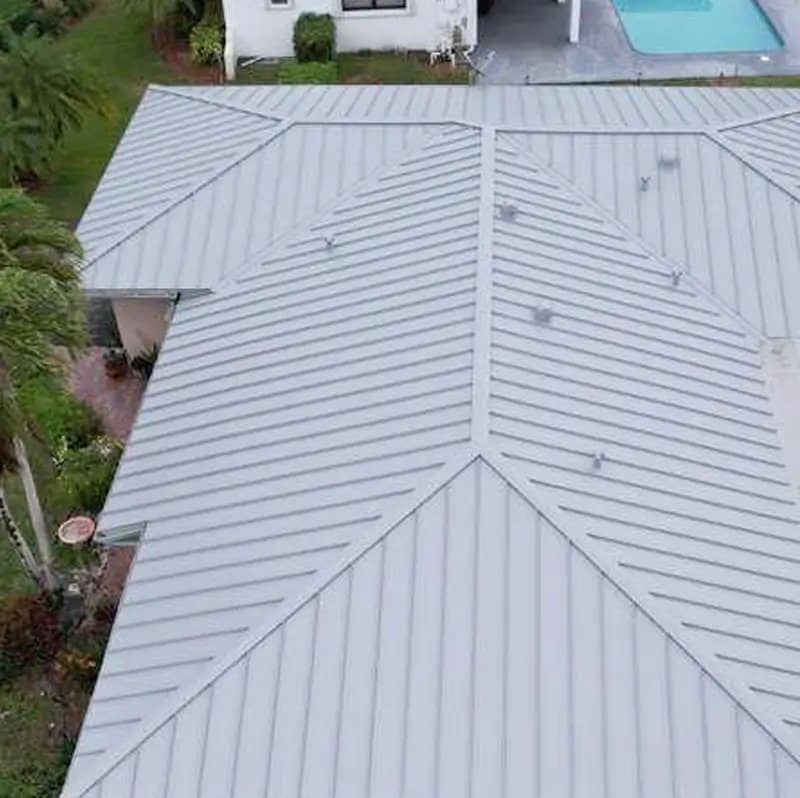 Silver standing seam metal roof on a South Florida home