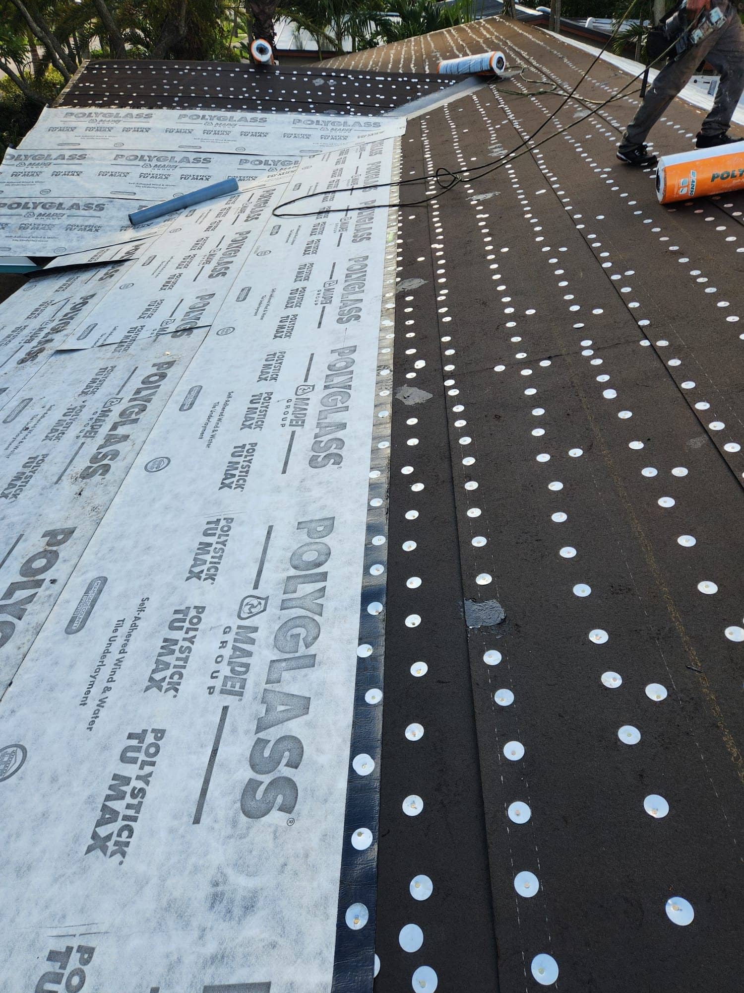 New underlayment going down during a roof replacement in Broward