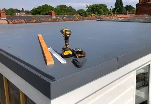 Finished flat roof with the crew’s tools on top