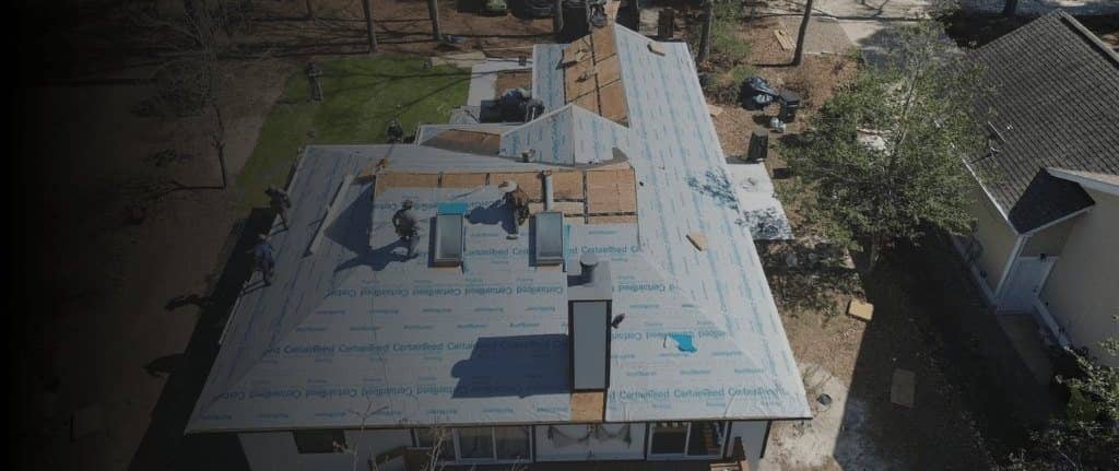 Roof replacement in progress, seen from above
